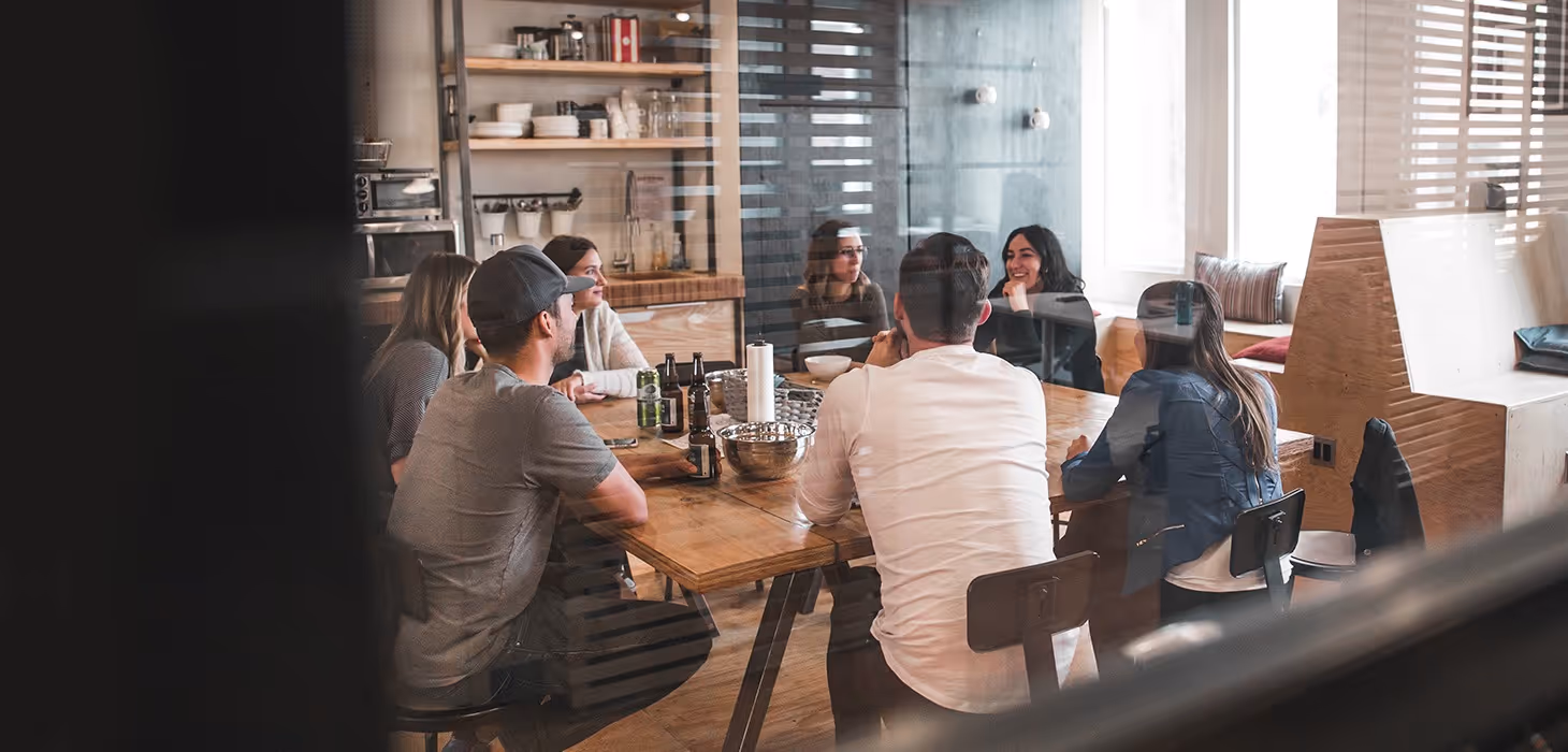 Employees sitting around a table
